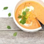 carrot and leek soup, scallions, creme fraiche