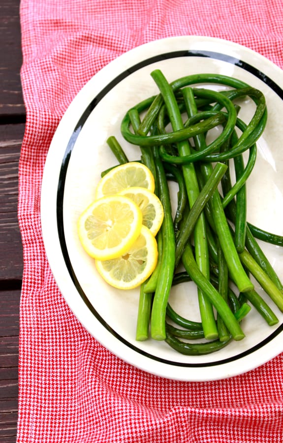 sauteed garlic scapes, sliced lemon, olive oil