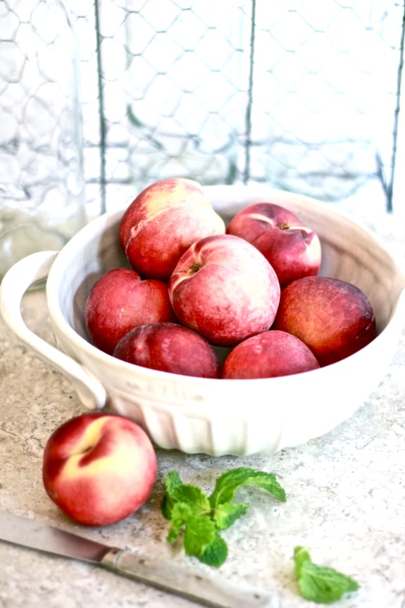 white peaches, ceramic measuring bowl