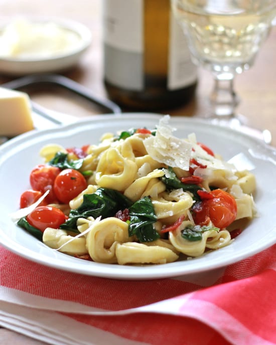 dinner tonight: tortellini with spinach and tomatoes