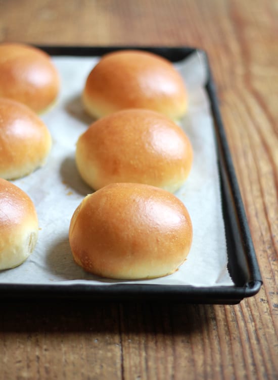 Tray of baked light brioche hamburger buns 