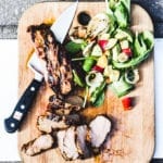 grilled pork tenderloin with wilted greens, sweet onions + peach vinaigrette | theclevercarrot.com
