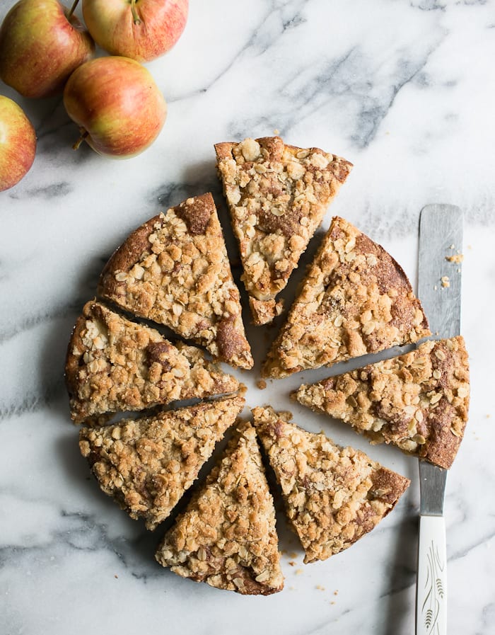 Fresh apple cake with crumble topping cut into slices