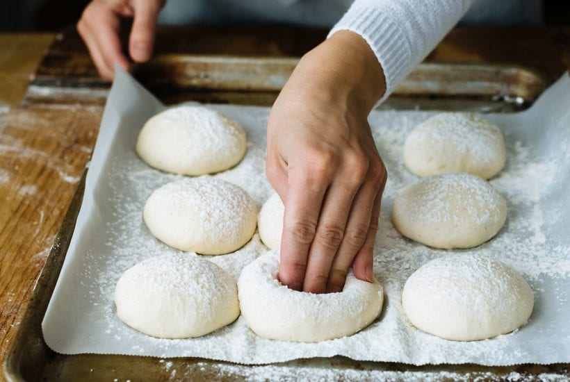 Baker shaping bread rolls | theclevercarrot.com