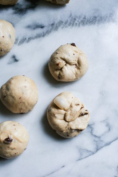 Sourdough hot cross bun dough shaped into balls