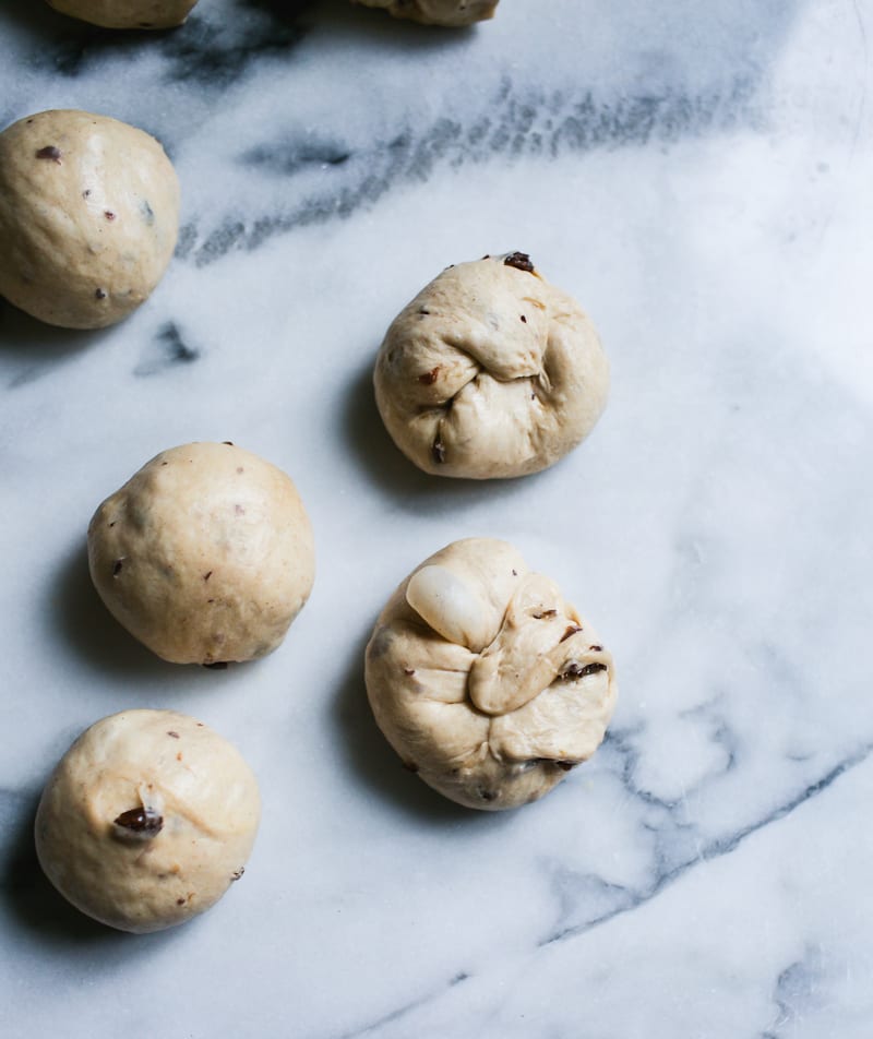 Sourdough hot cross bun dough shaped into balls