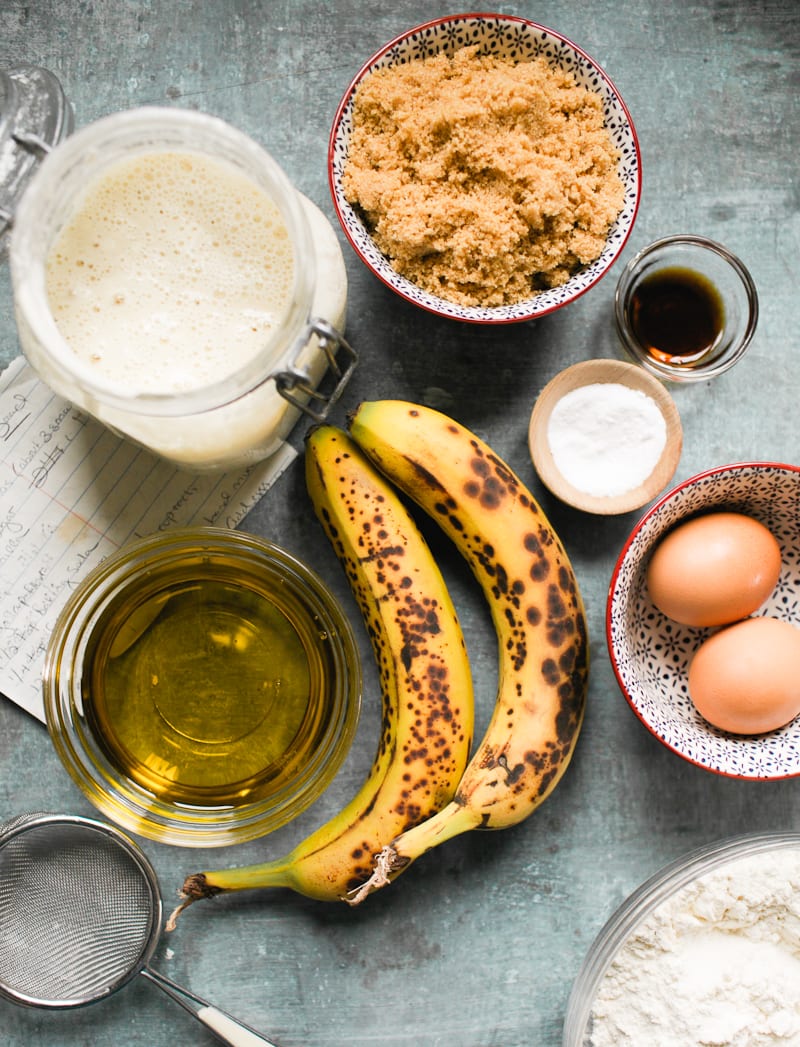 Sourdough banana bread ingredients: overripe bananas, brown sugar, eggs, vanilla, salt, baking soda, flour, oil, milk and sourdough starter