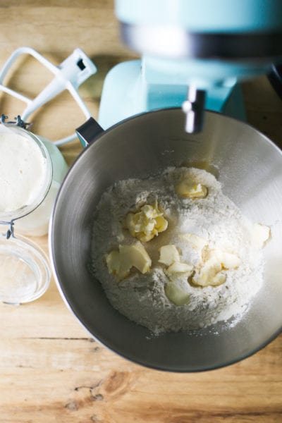 Flour and butter in a mixing bowl for sourdough sandwich bread