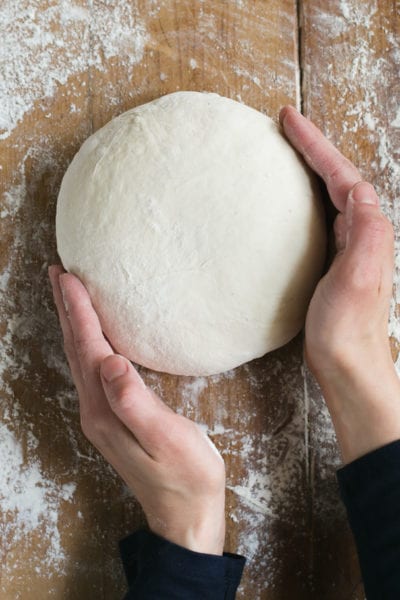 Round dough on work surface