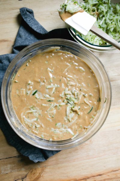 Sourdough zucchini bread batter in a glass mixing bowl