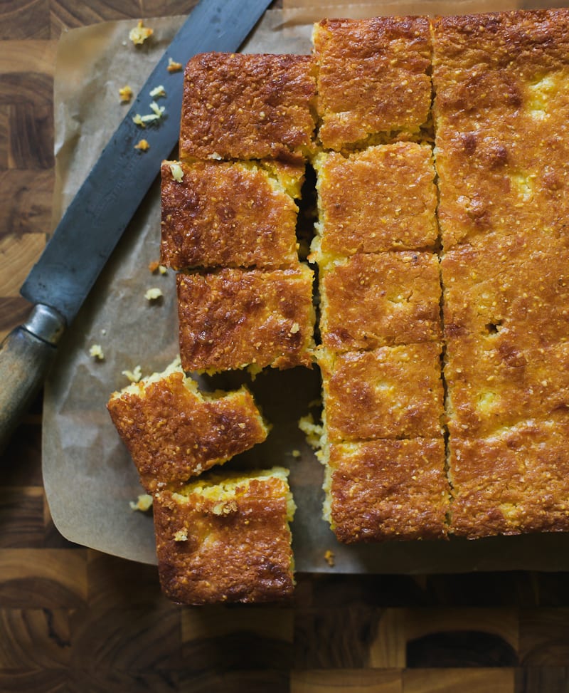 Thick-Cut Squares of Sourdough Cornbread on a Cutting Board