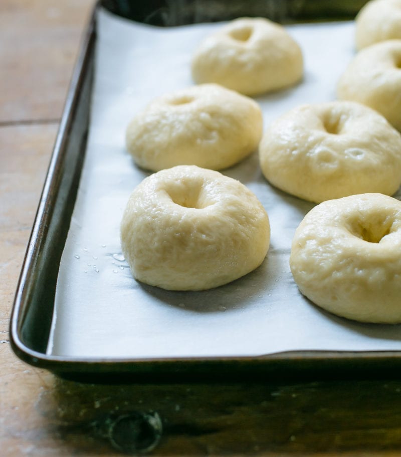 Boiled bagels on a sheet pan