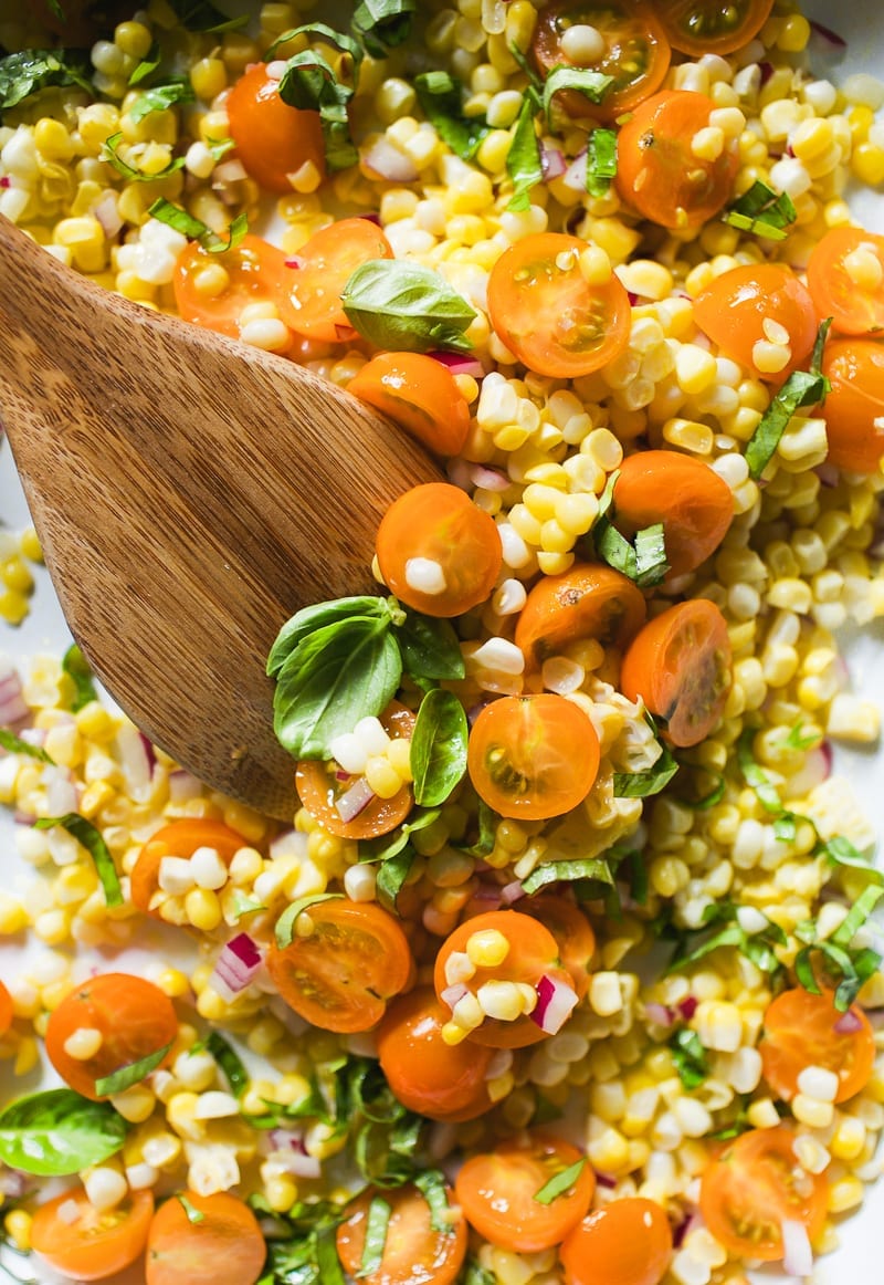 Fresh yellow corn, golden tomatoes, basil and red onion salad