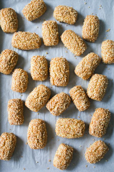 Tray of golden brown baked sesame cookies