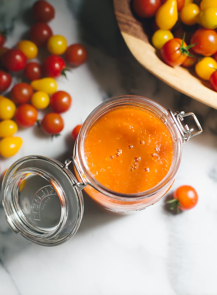 Jar of homemade tomato sauce made with fresh tomatoes.