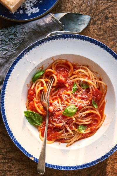 Spaghetti with homemade authentic Italian Italian tomato sauce and basil.