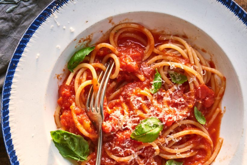 Spaghetti with homemade authentic Italian Italian tomato sauce and basil.