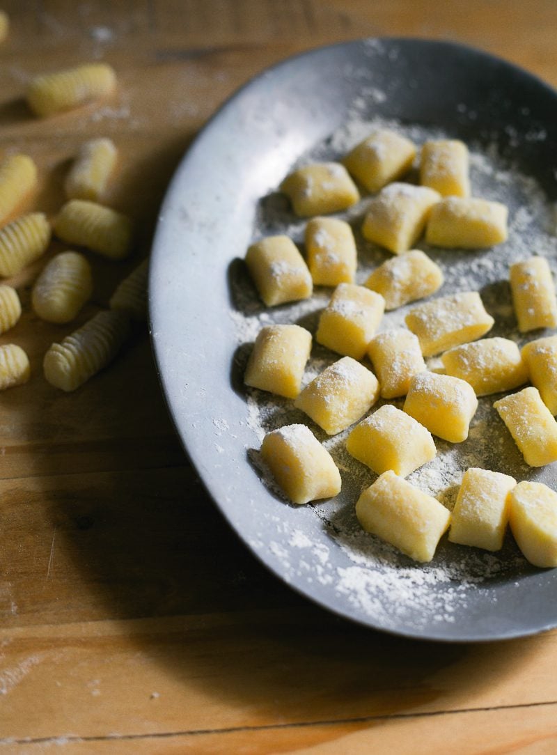 Fresh homemade potato gnocchi on an oval dish.