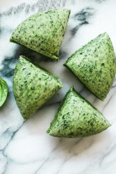 Spinach pasta dough cut into wedges