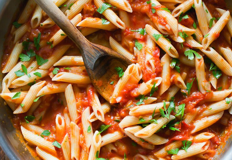 Arrabbiata sauce with penne pasta in a skillet