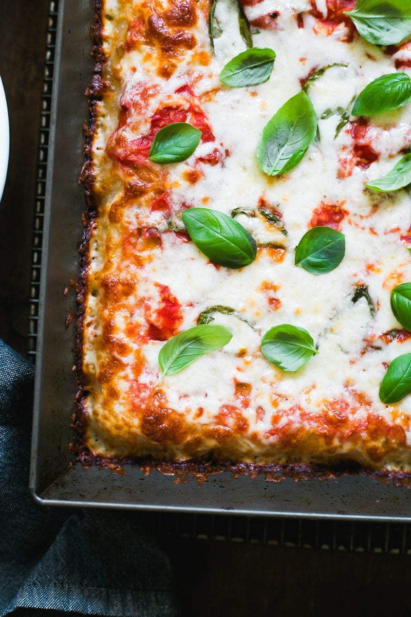 Crispy sourdough pizza crust with no-cook pizza sauce and fresh basil