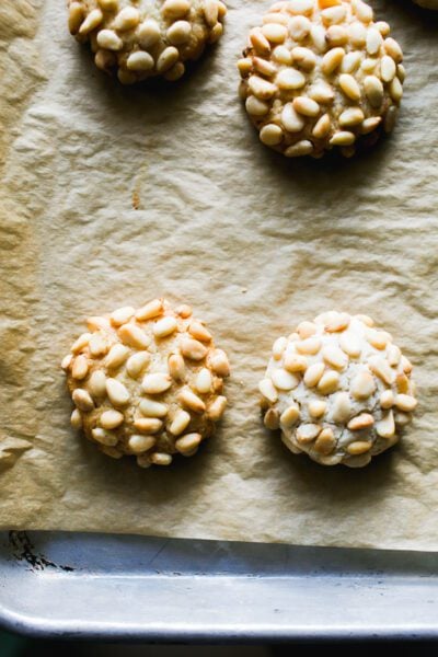 Pignoli cookies (Italian pine nut cookies) on a parchment-lined baking sheet