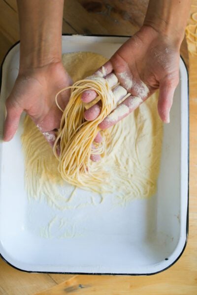 Sourdough pasta in a tray of semolina flour