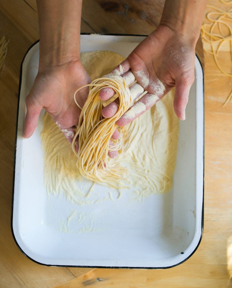 Sourdough pasta in a tray of semolina flour