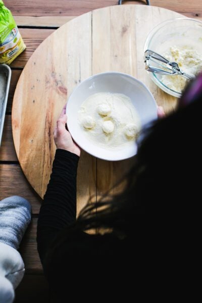 Rolling ricotta gnocchi in semolina flour
