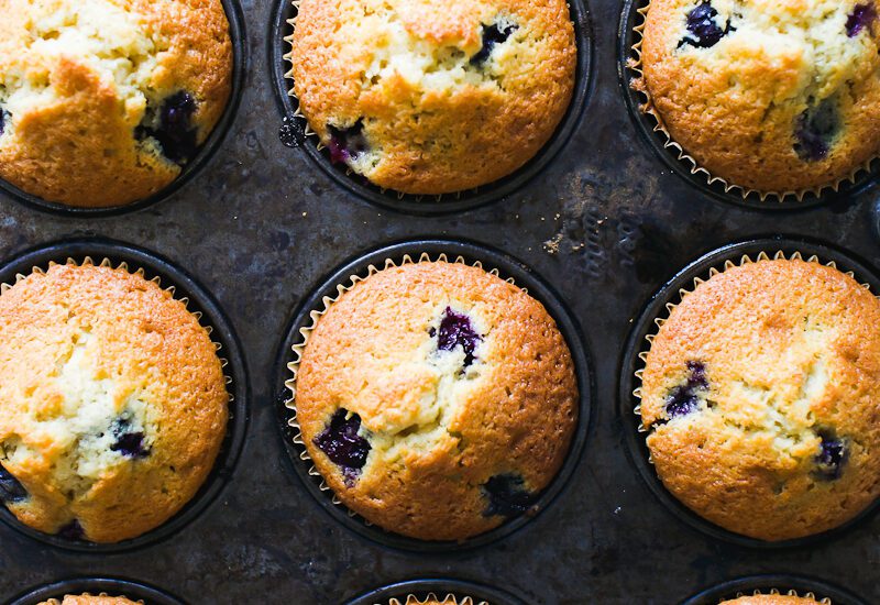 Sourdough blueberry muffins in a vintage tin
