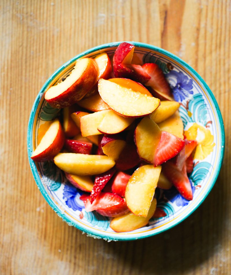 Bowl of peaches and strawberries