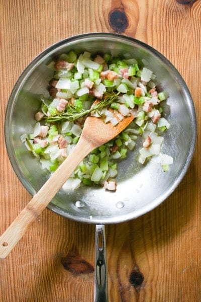 Diced bacon, onions, celery, garlic and rosemary in a skillet cooked for 10 minutes.