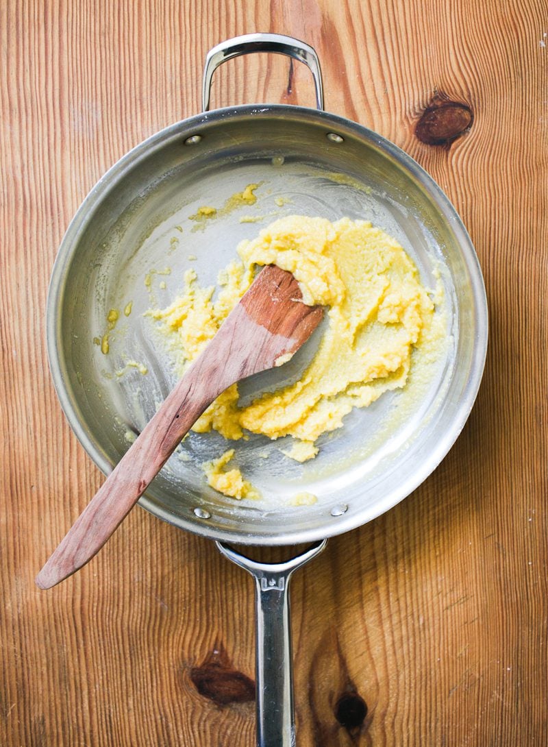 Mixed butter and flour in a skillet with a wooden spoon (roux)