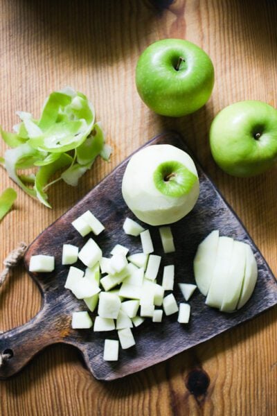 Chopped green apples on a cutting board