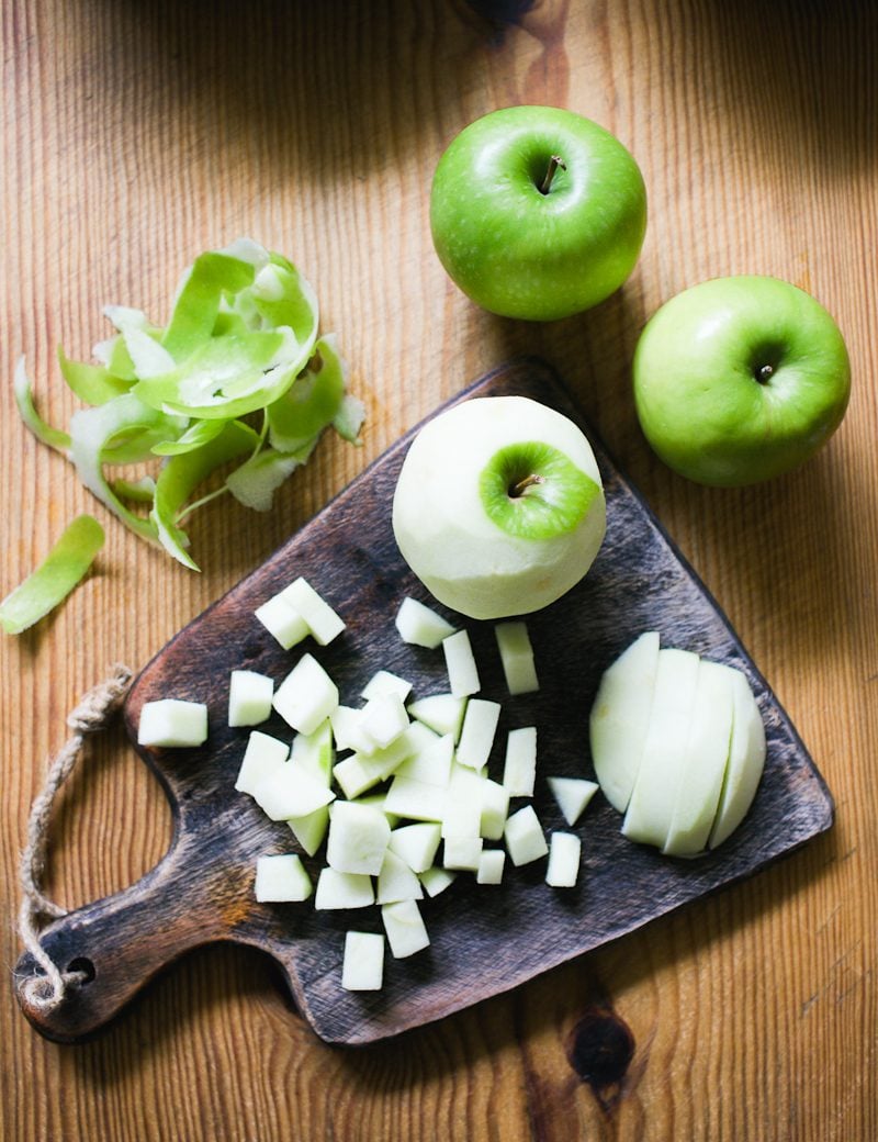Chopped green apples on a cutting board