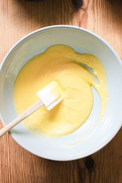 Creamed butter, sugar and eggs in a large light blue bowl
