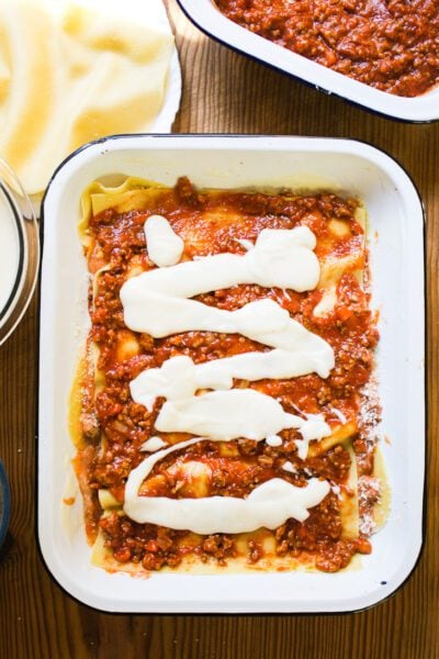 Layer of lasagna noodles w/ ragù Bolognese sauce & béchamel sauce