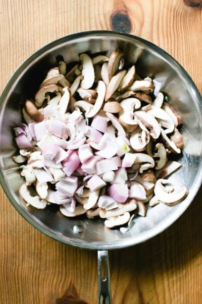 Sliced mushrooms, shallots and garlic in a large skillet