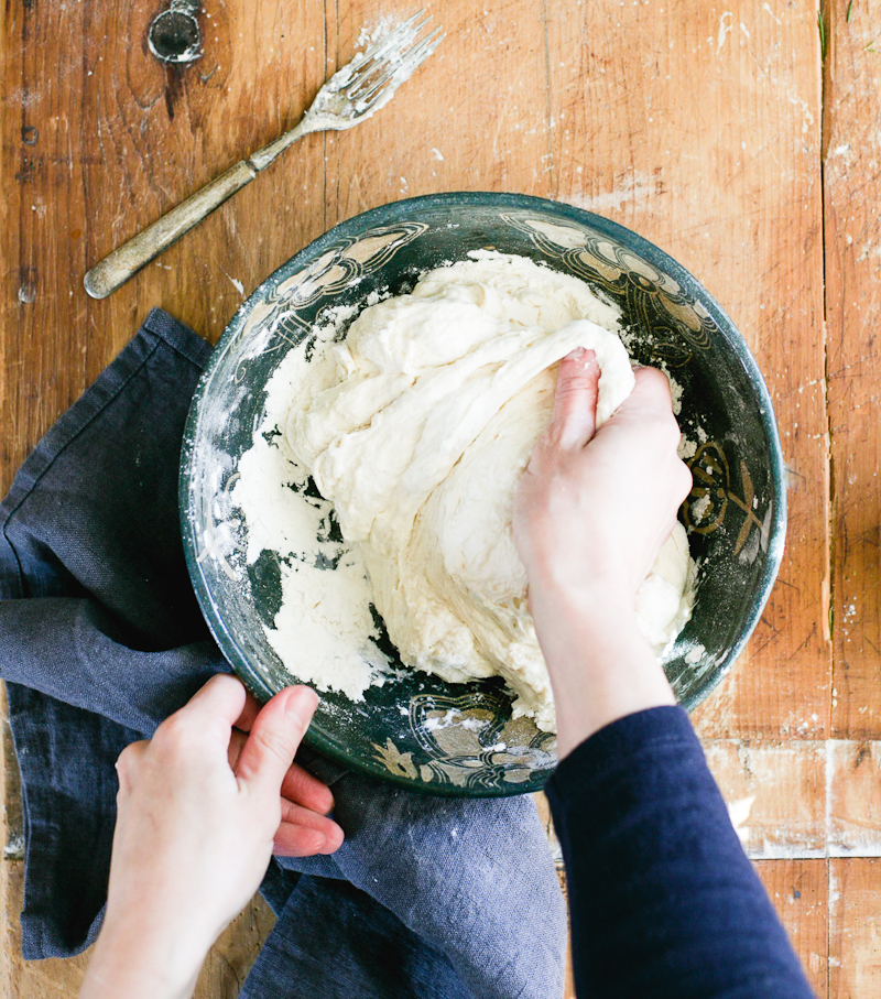 Sourdough garlic knot dough in a blue mixing bowl