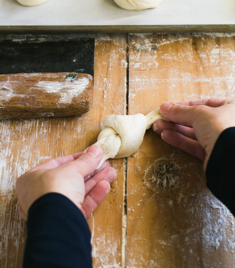 Hand shaping sourdough garlic knots