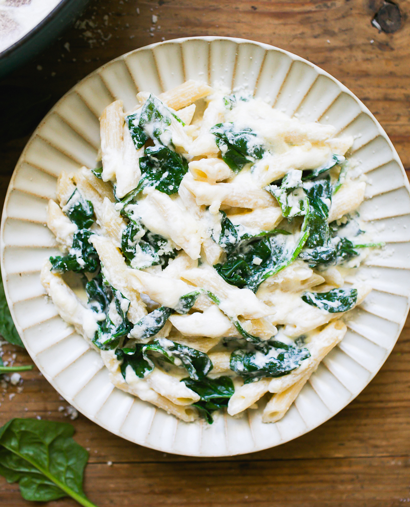 Penne pasta with creamy, homemade ricotta sauce, lemon and spinach