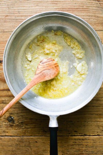 Sautéed chopped shallots and garlic in a pan with melted butter, deglazed with vodka