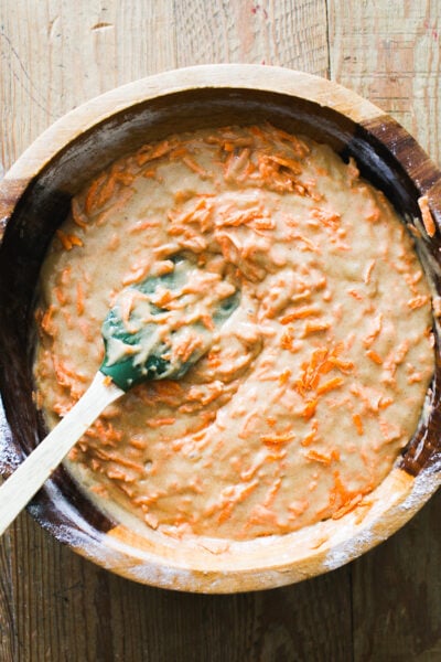 Mixed sourdough carrot cake batter with shredded carrots