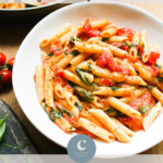 Penne pasta with cherry tomatoes and basil