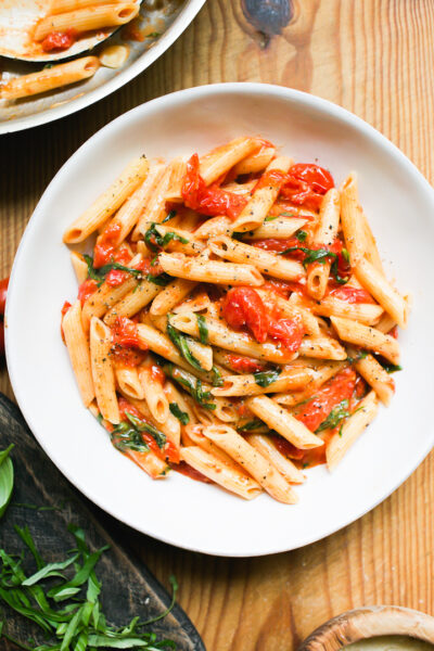Juicy penne pasta with sweet cherry tomatoes and basil