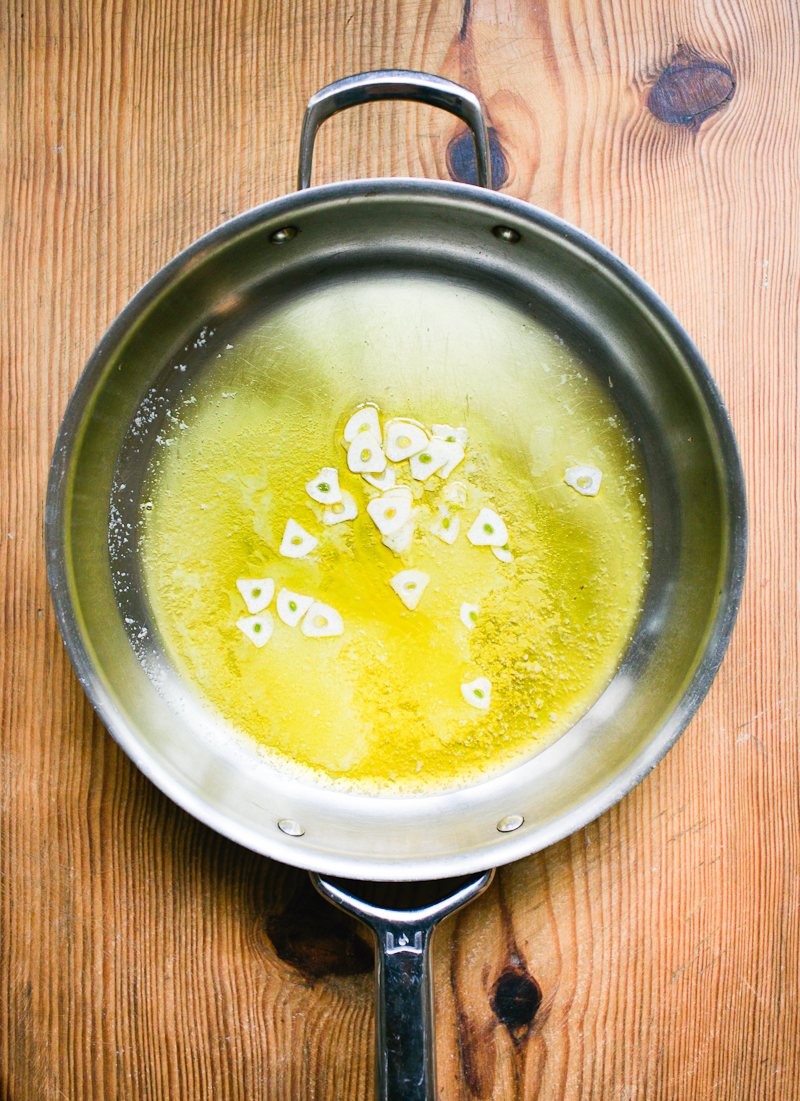 Melted butter, oil and sliced garlic in a pan