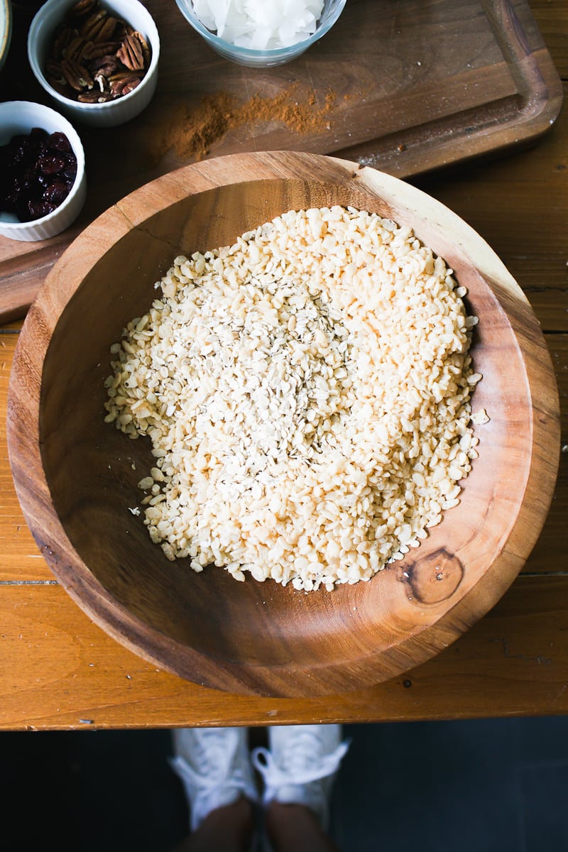 Old fashioned rolled oats and puffed rice cereal in a wooden bowl