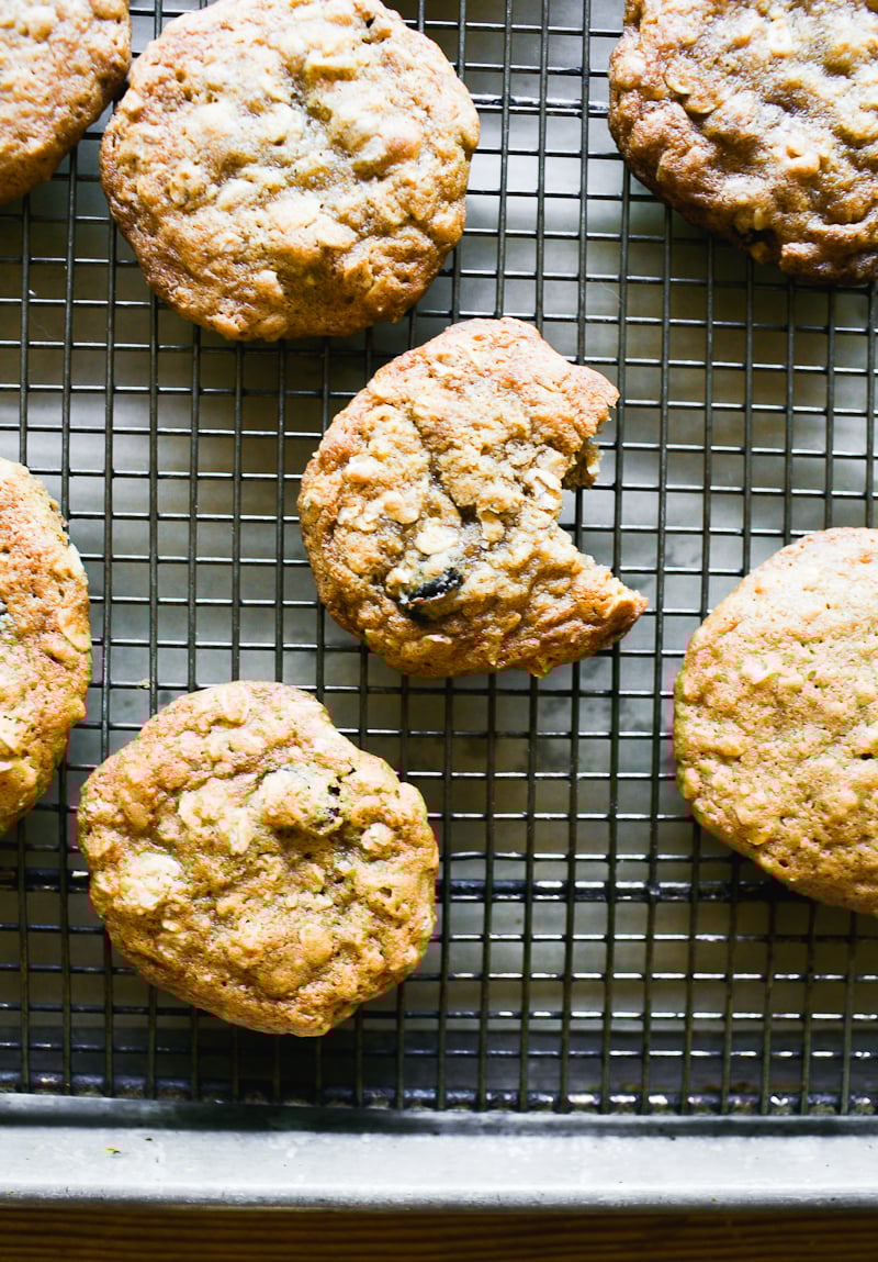 Soft sourdough oatmeal raisin cookies on a wire rack