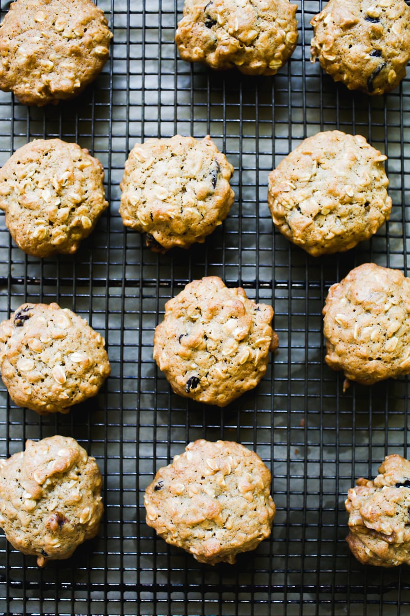 Soft and chewy sourdough oatmeal raisin cookies on a wire rack
