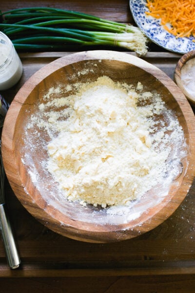 Flour, baking powder, salt & cold cubed butter rubbed together until sandy-looking